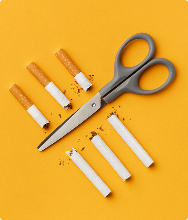 Scissors cutting Cigarettes